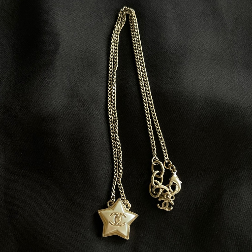 Authentic Chanel pearl star necklace